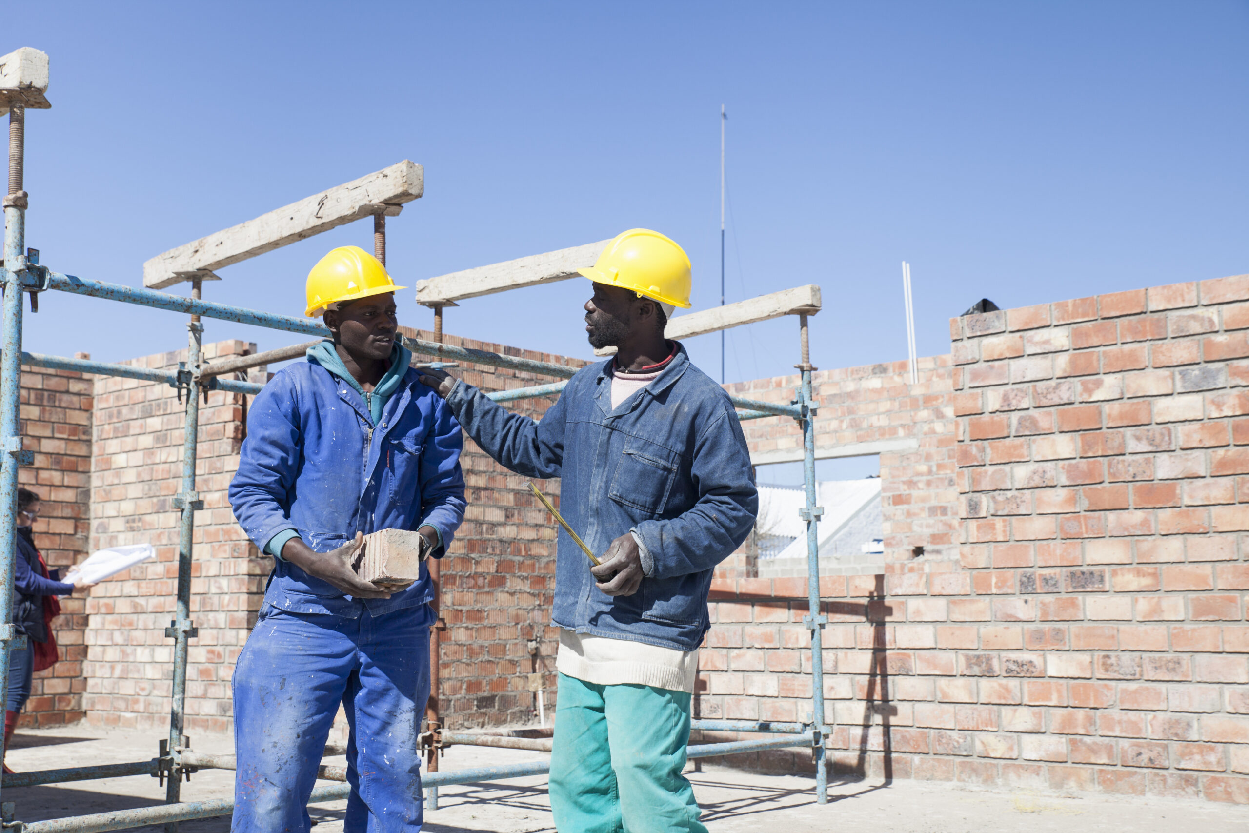 builders talking on building site 2025 04 04 12 22 49 utc scaled